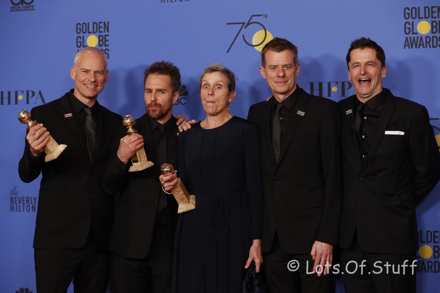 Martin McDonagh, left, Sam Rockwell, Frances McDormand, Graham Broadbent and Peter Czernin celebrate after winning the award for best motion picture drama for "Three Billboards Outside Ebbing, Missouri." Rockwell and McDormand won acting awards for the film too.