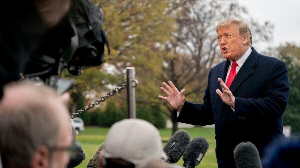 President Trump speaks to reporters on the south lawn of the White House on Nov. 26.