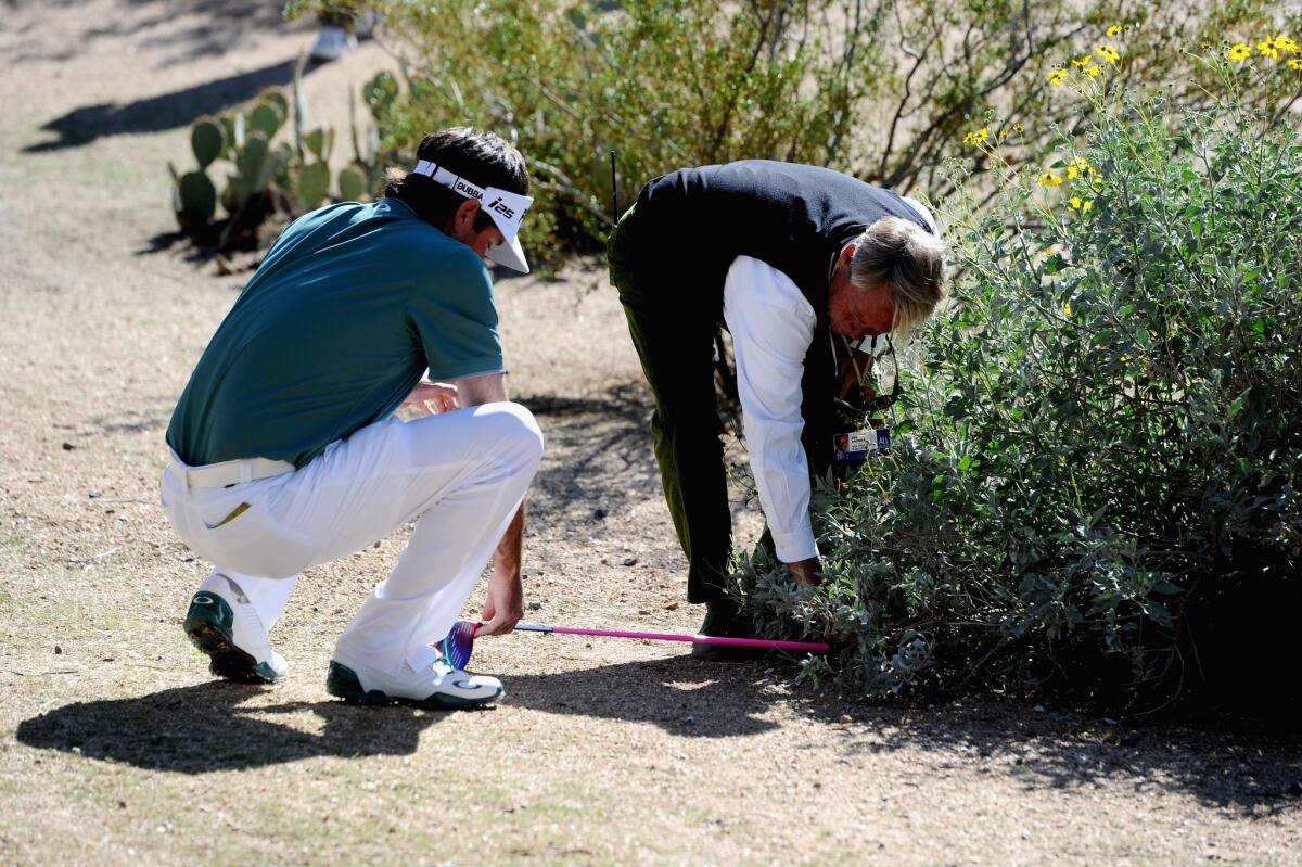 Bubba Watson prepares to play a drop at No. 13 during the third round of the Phoenix Open at TPC Scottsdale on Saturday.