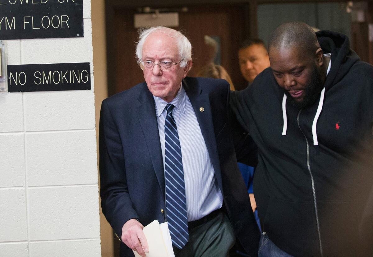 Bernie Sanders and rapper Killer Mike arrive for a rally at Claflin University in Orangeburg, S.C.