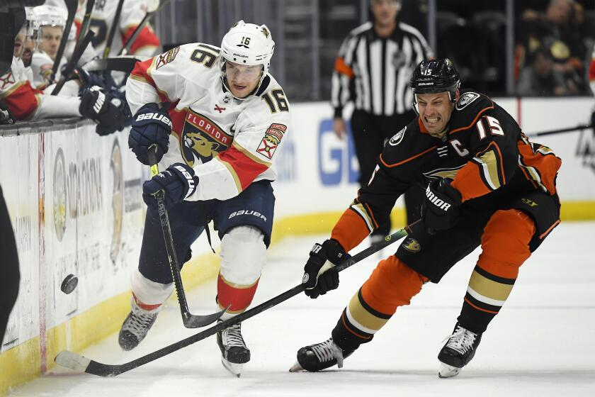 Florida Panthers center Aleksander Barkov, left, battles for the puck with Anaheim Ducks center Ryan Getzlaf during the third period of an NHL hockey game Wednesday, Feb. 19, 2020, in Anaheim, Calif. The Panthers won 4-1. (AP Photo/Mark J. Terrill)