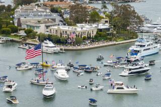 NEWPORT BEACH, CA - JUNE 08: Supporters turned out, even on boats, for Donald Trump's fundraising visit to Newport Beach hosted by Palmer Luckey and Kimberly and John Word on Saturday, June 8, 2024. (Myung J. Chun / Los Angeles Times)