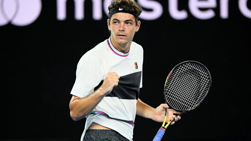 Taylor Fritz celebrates a point in his third-round loss to Roger Federer at the Australian Open.
