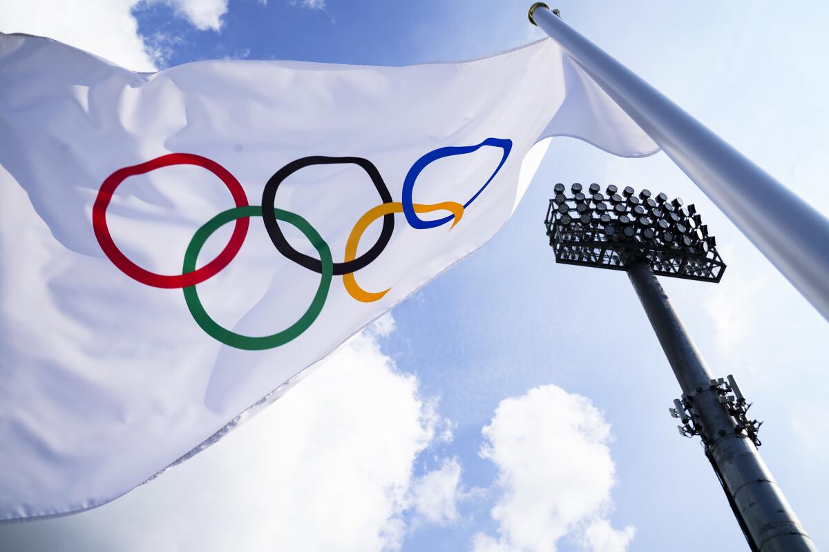 A flag bearing the Olympic rings on display in Tokyo.