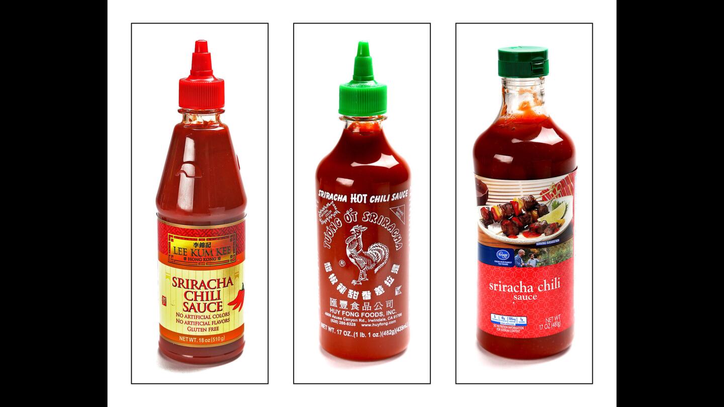 Trio of Srirach sauce bottles