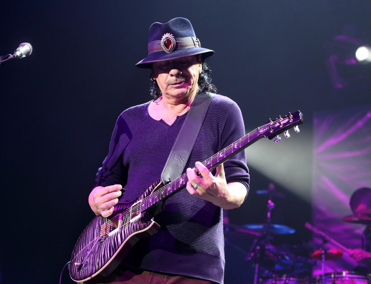 Guitarist Carlos Santana passes out on stage during U.S. concert