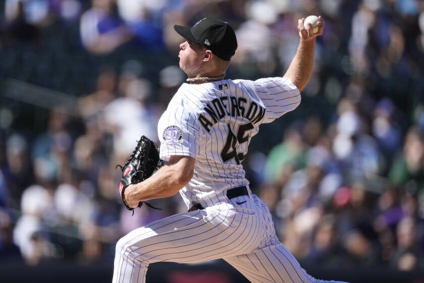 Colorado Rockies starting pitcher Chase Anderson works against the Los Angeles Dodgers in the first inning of the first game of a baseball doubleheader on Tuesday, Sept. 26, 2023, in Denver. (AP Photo/David Zalubowski)