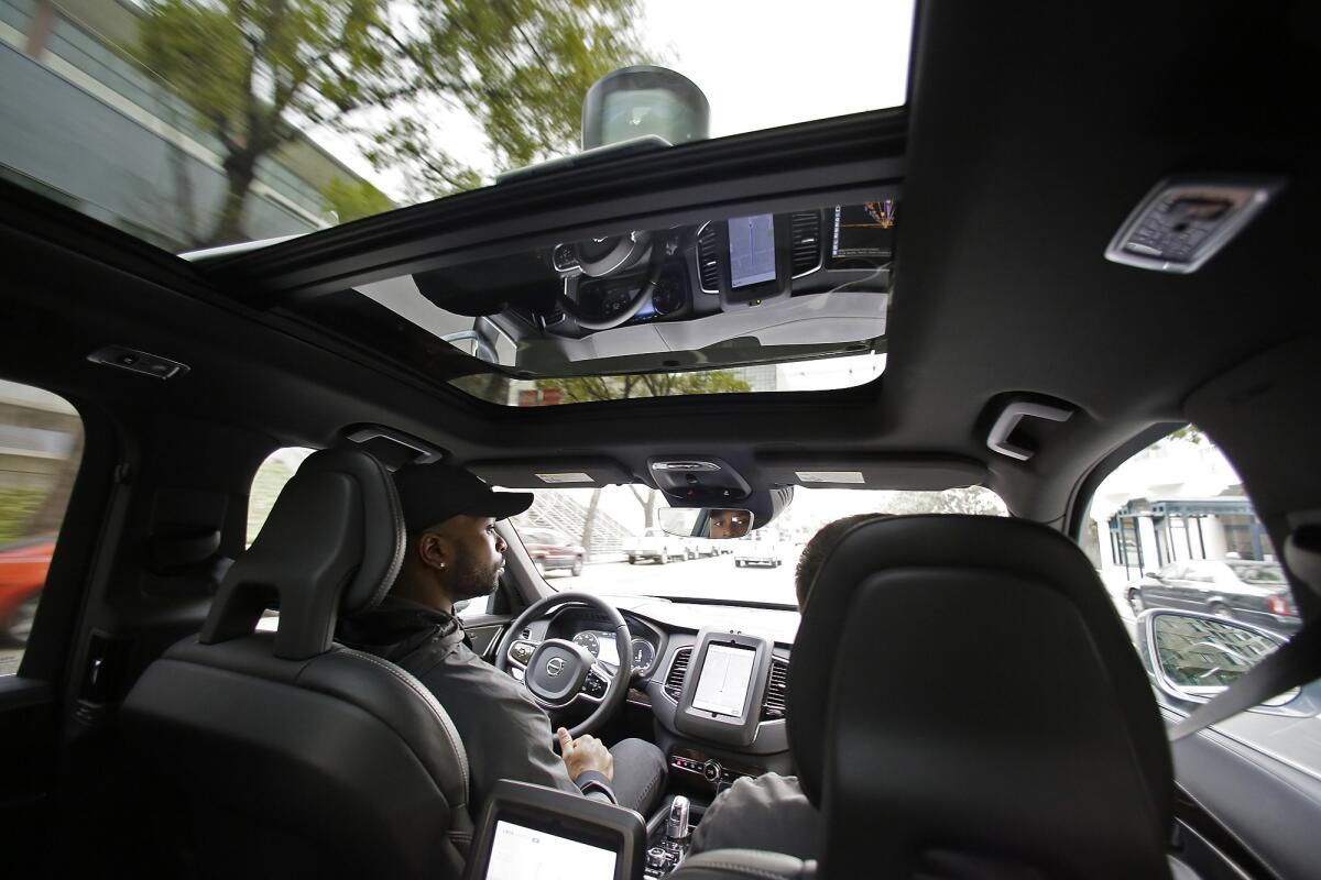 Self-driving vehicles in Arizona operate with the “same registration requirements as any other vehicle,” according to the Arizona Department of Transportation. Above, an Uber self-driving car during a test drive in San Francisco this month.