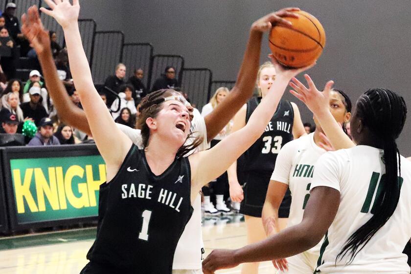 Sage Hill's Emily Eadie (1) reaches for the rebound during Sage Hill High School girls' basketball team against Ontario Christian High School girls' basketball team in the CIF State Southern California Regional Open Division girls' basketball playoff game at Ontario Christian High School in Ontario on Wednesday, February 28, 2024. (Photo by James Carbone)