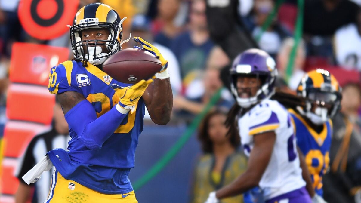 Rams running back Todd Gurley catches a touchdown pass against the Vikings in the first quarter at the Coliseum.