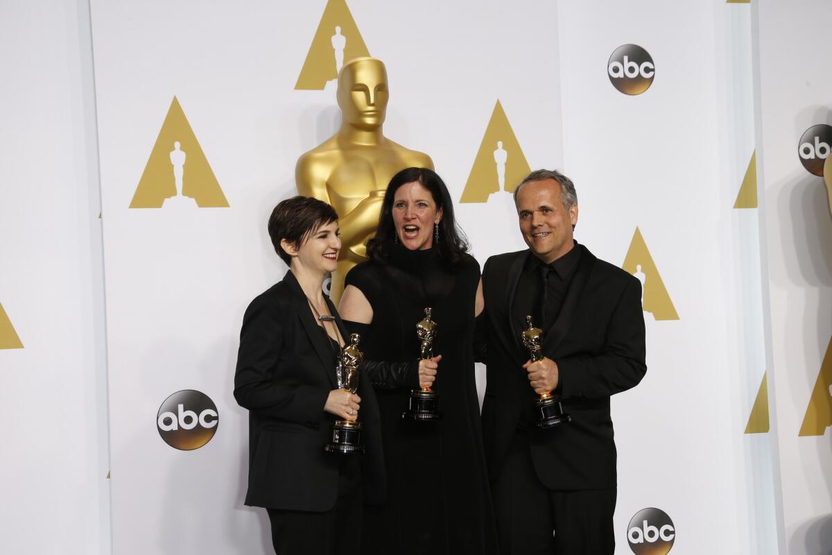 Winners for documentary feature "CitizenFour": Mathilde Bonnefoy, from left, Laura Poitras and Dirk Wilutzky backstage at the 87th Academy Awards.