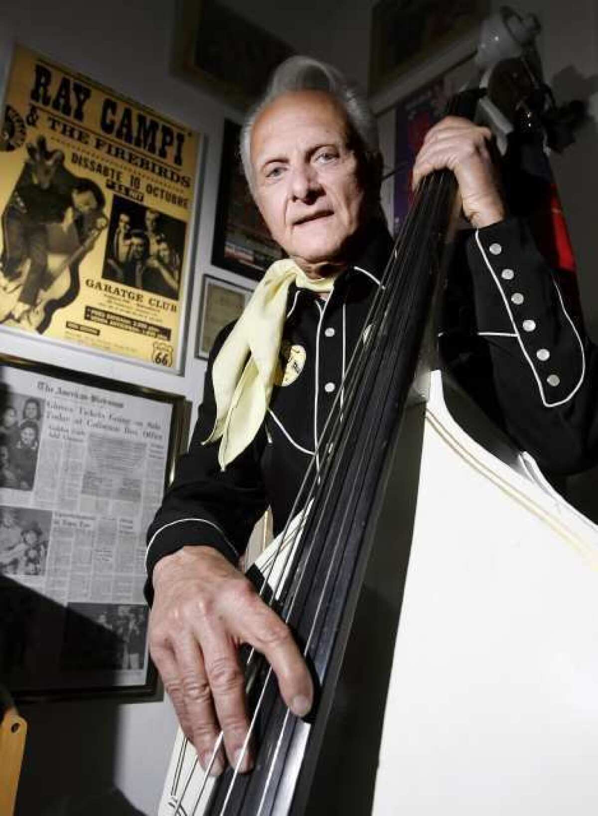 Rockabilly pioneer Ray Campi and his upright bass at his home in Los Angeles. Campi will perform at Burbank's Viva Cantina to celebrate his 78th birthday.
