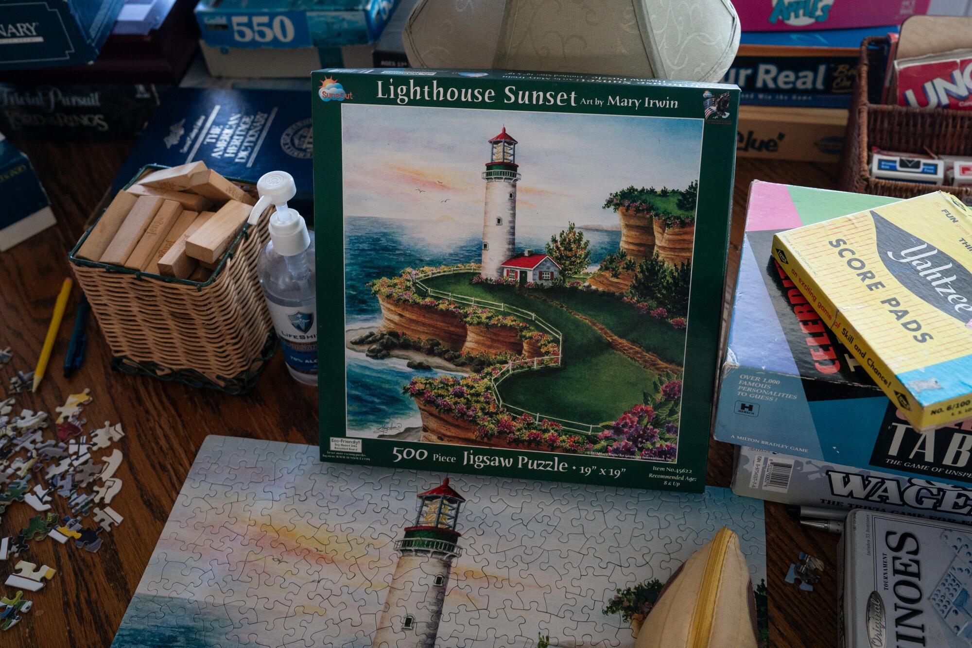 A "Lighthouse Sunset" puzzle and its box on a table in the game room at East Brother Light Station.