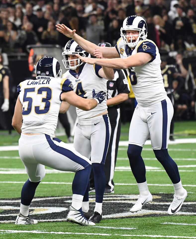 Rams kicker Greg Zuerlien celebrates with Justin Lawler (53) and Johhny Hekker, right, after a game-winning field goal in overtime against the New Orleans Saints in the NFC Championship at the Superdome in New Orleans Sunday.