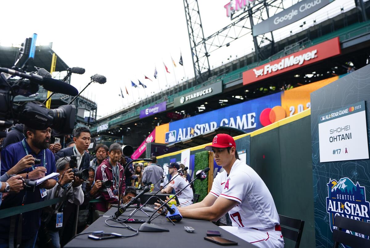 Shohei Ohtani speaks to reporters Monday at T-Mobile Park in Seattle.