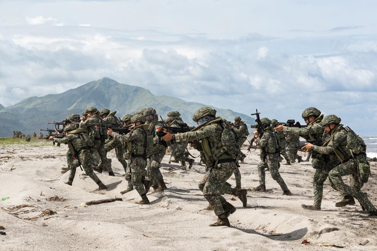 Australian, US, Filipino forces practice retaking an island in a drill