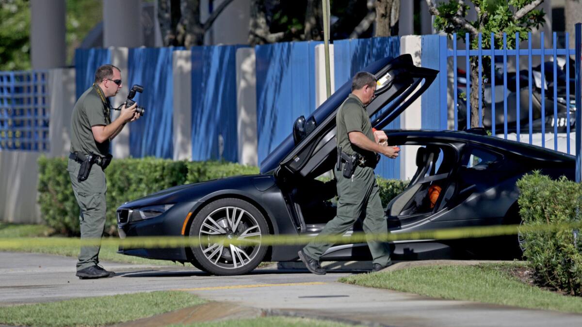 Police investigate the scene of XXXTentacion's death.