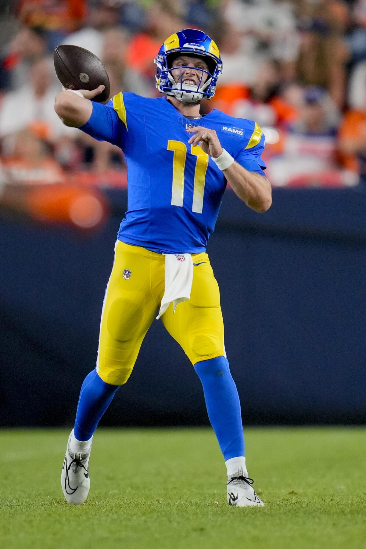 Rams quarterback Brett Rypien (11) throws in a preseason game against Denver.