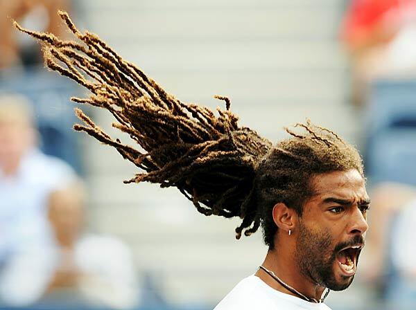 Dustin Brown of Jamaica yells after winning a point against Andy Murray of Scotland during the second round of play at the U.S. Open on Friday. Brown would lose the match.