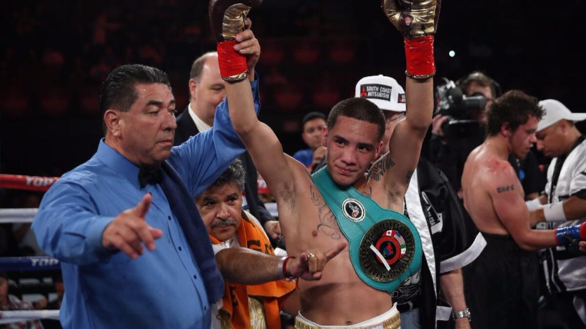 Oscar Valdez celebrates a victory in 2014. He will defend his WBO featherweight title against Argentina's Matias Rueda on Nov. 5 in Las Vegas.