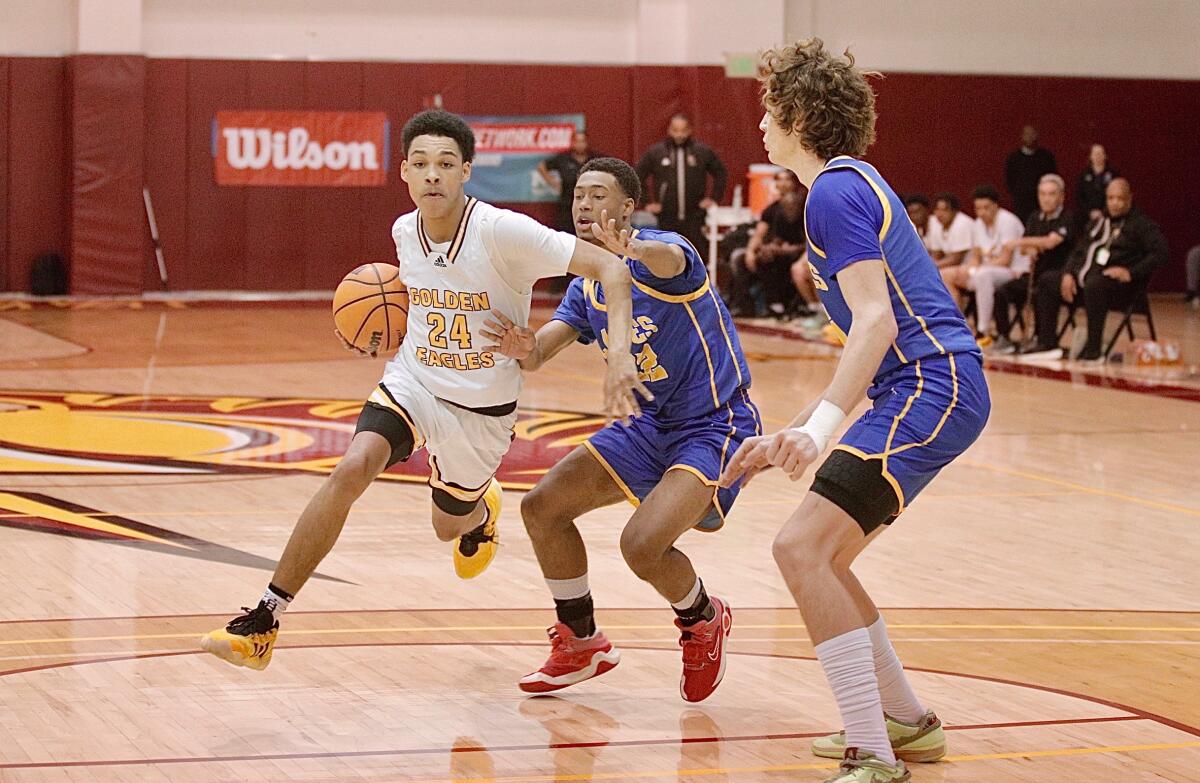 King/Drew guard Donald Thompson drives to the basket against LACES.