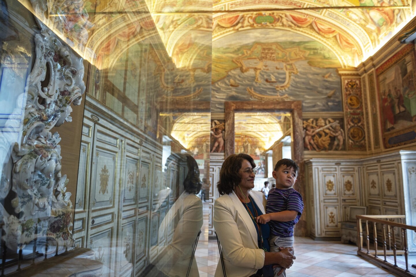 Maria Hilda Gonzalez and her 2-year-old grandson, Liam, visit the Vatican Museums in Vatican City on Thursday.