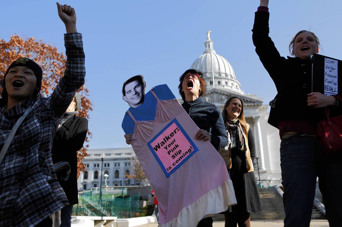 Linda Hedenblad, of Madison (center) brings a likeness of Wisconsin Gov. Scott Walker to the daily Solidarity Sing-Along at the State Capitol in Madison. The singers, who have been singing protest songs at noon in or around the Capitol for months, held a special gathering to kick off the first day of petition signing to force a recall vote on Wisconsin Gov. Scott Walker and Lt. Gov. Rebecca Kleefisch.