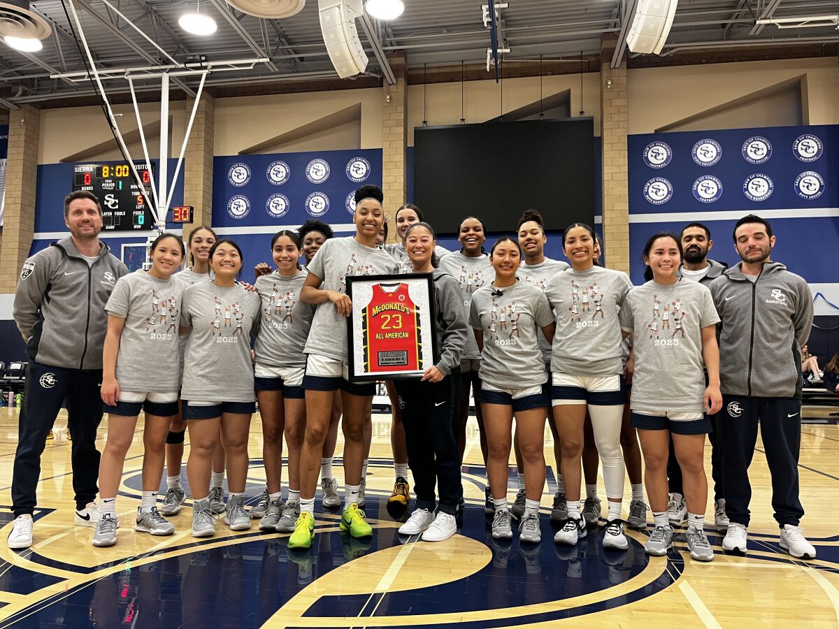 Juju Watkins is presented her McDonald's All-American award before scoring 60 points on Tuesday night for Sierra Canyon.