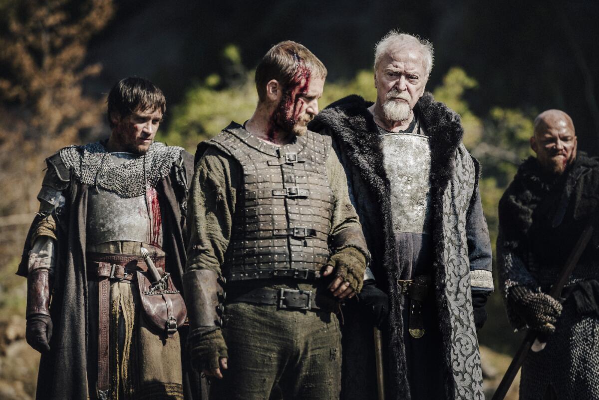 Ben Foster, center left, and Michael Caine, center right, in the movie "Medieval."