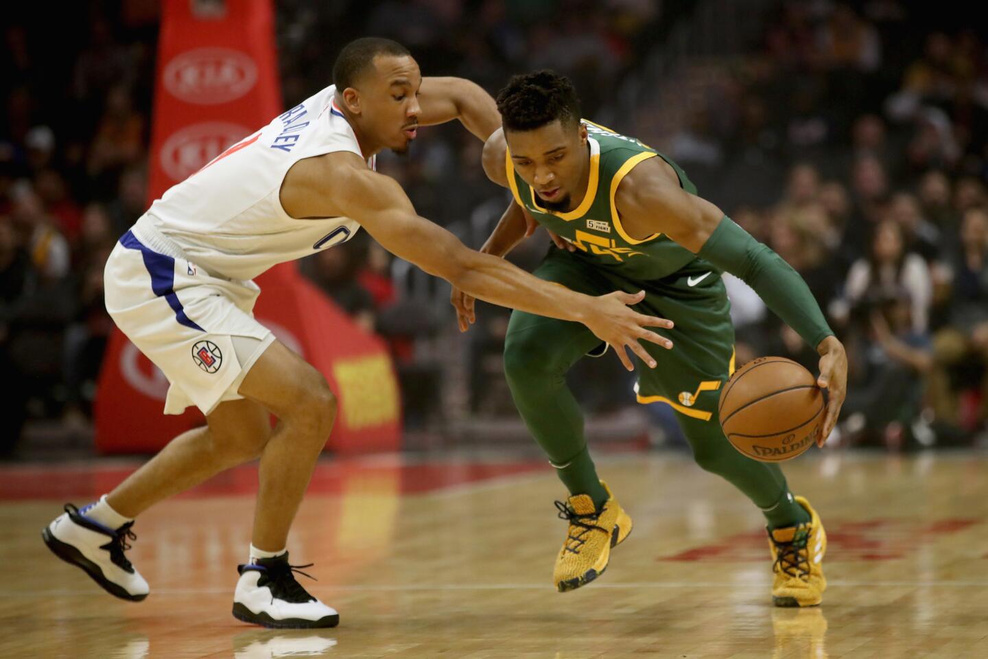 LOS ANGELES, CA - JANUARY 16: Avery Bradley #11 of the Los Angeles Clippers defends agains the dribble of Donovan Mitchell #45 of the Utah Jazz during the first half of a game at Staples Center on January 16, 2019 in Los Angeles, California. NOTE TO USER: User expressly acknowledges and agrees that, by downloading and or using this photograph, User is consenting to the terms and conditions of the Getty Images License Agreement. (Photo by Sean M. Haffey/Getty Images) ** OUTS - ELSENT, FPG, CM - OUTS * NM, PH, VA if sourced by CT, LA or MoD **