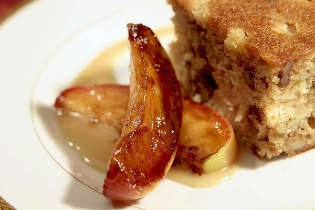 Apple date honey cake with sweet sesame sauce and sauteed apples.