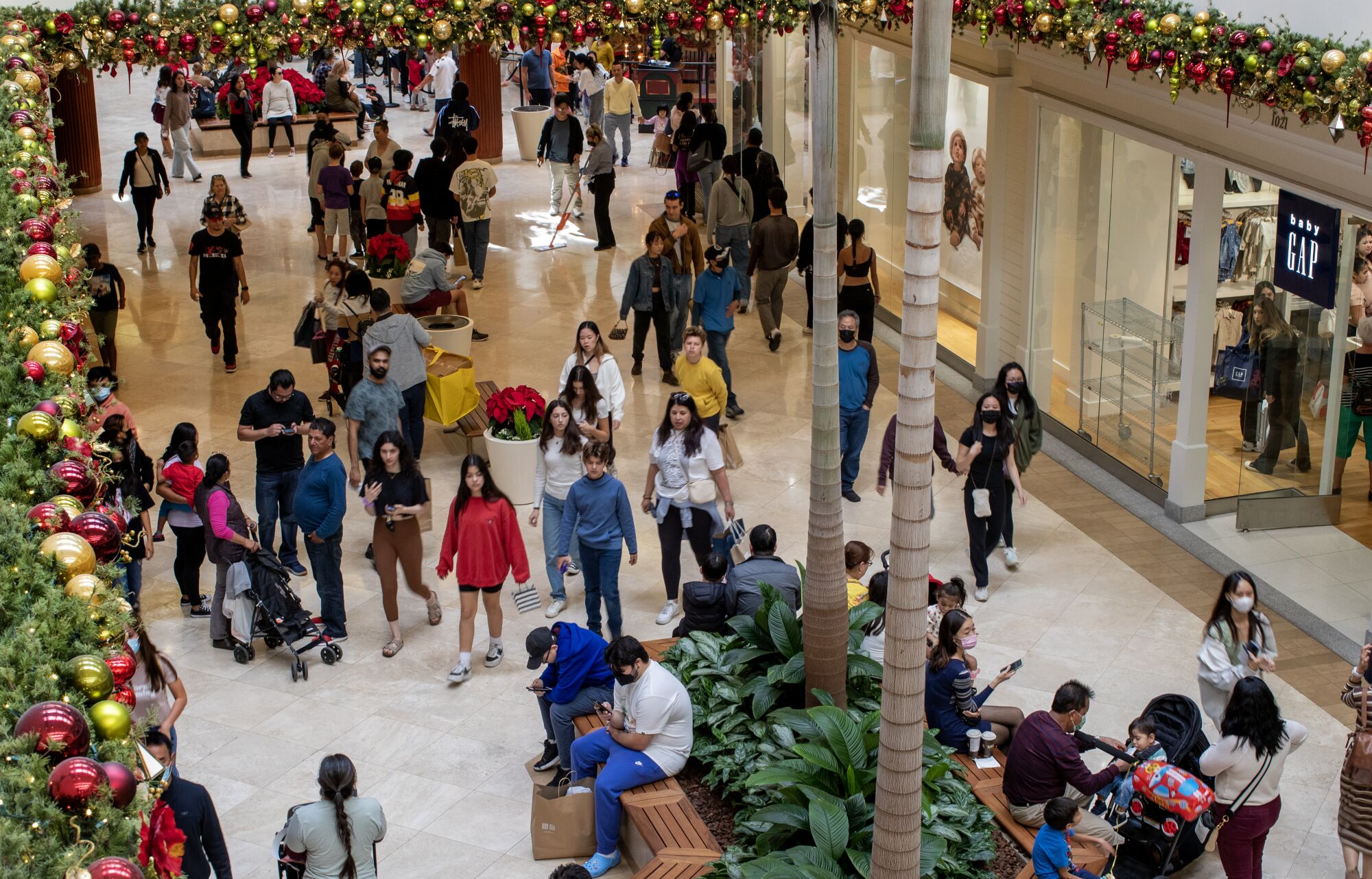 A birds-eye view of shoppers search for Black Friday deals at South Coast Plaza on Friday morning in Costa Mesa.