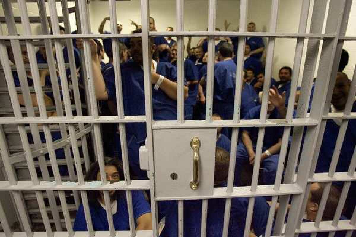Dozens of men fill a holding cell. The governor proposes a prisoner swap, trading long-term inmates that jails are ill-prepared to handle in return for short-term felons the state would just as soon not have to hold.