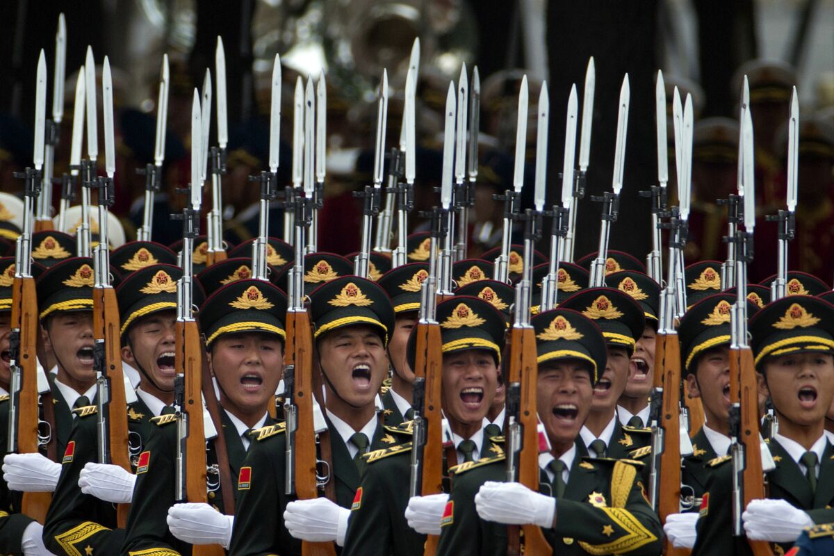 Members of a Chinese honor guard take part in a welcome ceremony for Belgium's King Philippe in Beijing on June 23. China’s top legislature has adopted a sweeping new national security law touching on everything from the military and economy to religion and the Internet.