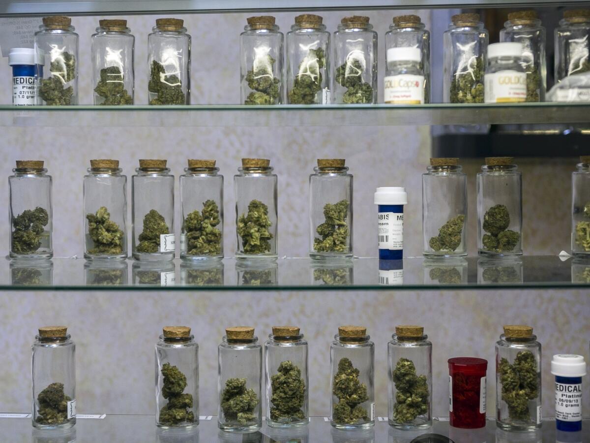 Vials of pot are displayed at the Venice Beach Care Center medical marijuana dispensary in Venice, Calif.