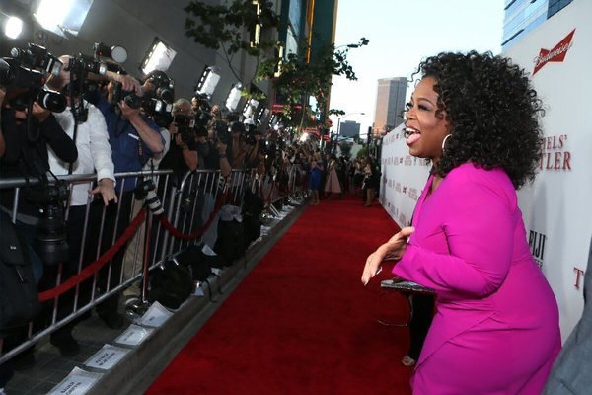 Oprah Winfrey appears at the Los Angeles premiere of "The Butler."
