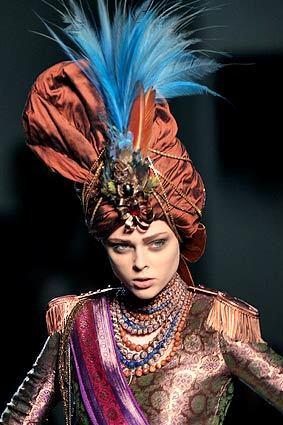 The fall couture collections in Paris were steeped in decadence, with models draped in elegant fabrics with elaborate additions of feathers and jewels. Jean Paul Gaultiers turban look with feathers and beads conjured silky visions of princes and maharajas.