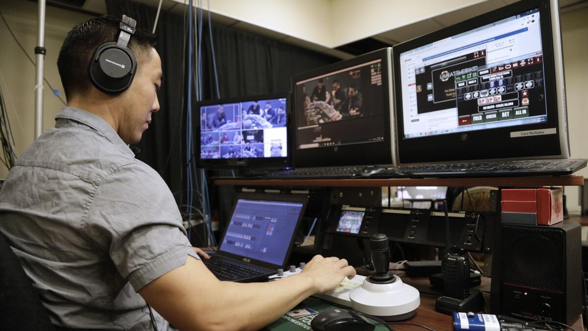 Brian Arakaki directs the "Live at the Bike" poker tournament from the control room at the Bicycle Casino.