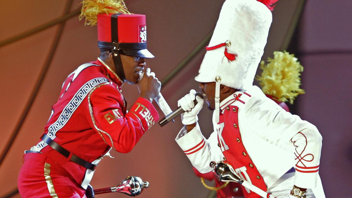 Jamie Foxx, left, and Kanye West perform "Gold Digger" at Staples Center in February 2006.