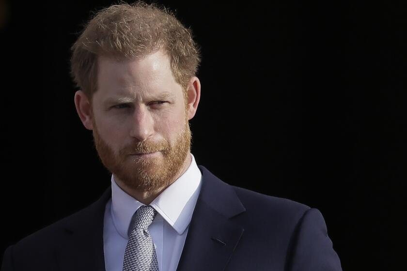 FILE - Britain's Prince Harry arrives in the gardens of Buckingham Palace in London, Jan 16, 2020. Buckingham Palace says Prince Harry will attend the Coronation service of his father, King Charles III, at Westminster Abbey on May 6, setting aside months of speculation about his presence. (AP Photo/Kirsty Wigglesworth, File)