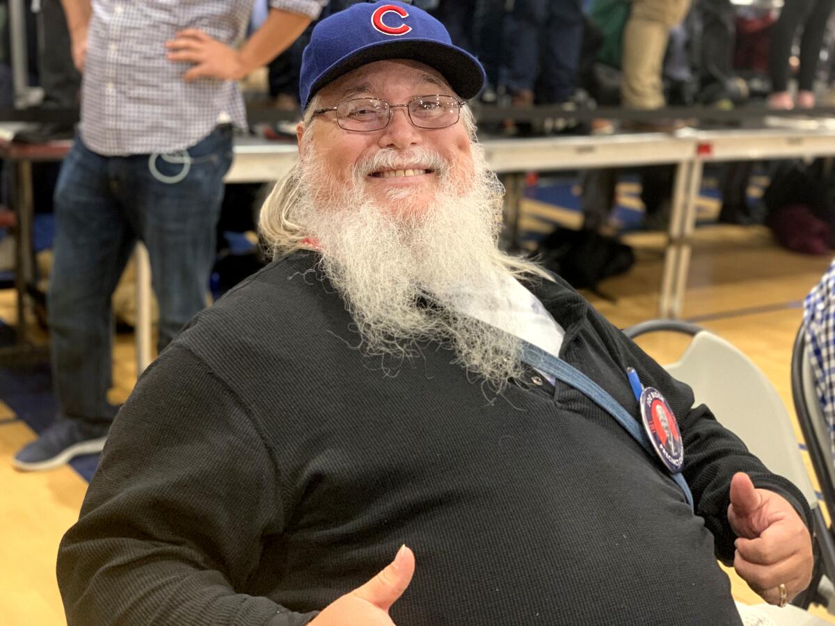 Jamie Lakers, 62, is a retired federal government employee from Des Moines caucusing for Joe Biden.