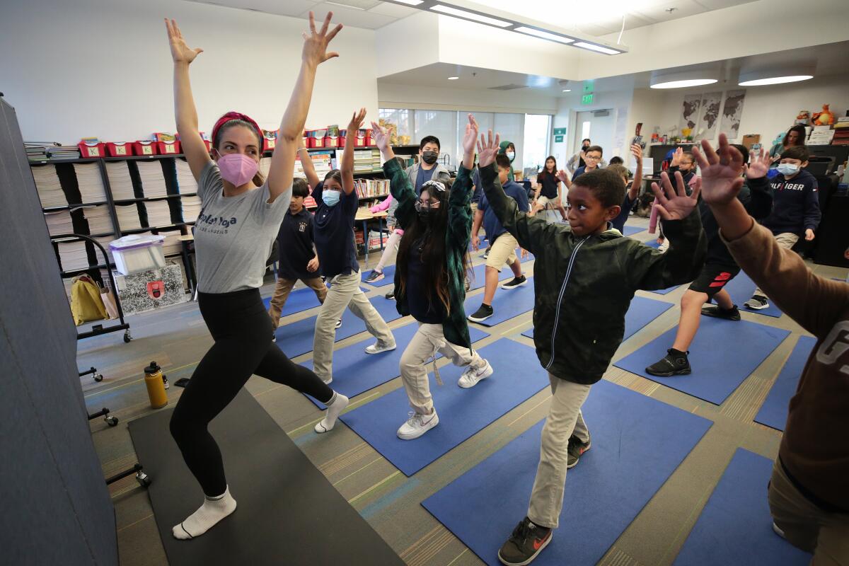 Leah Gallegos leads a yoga class at an elementary school in Los Angeles.