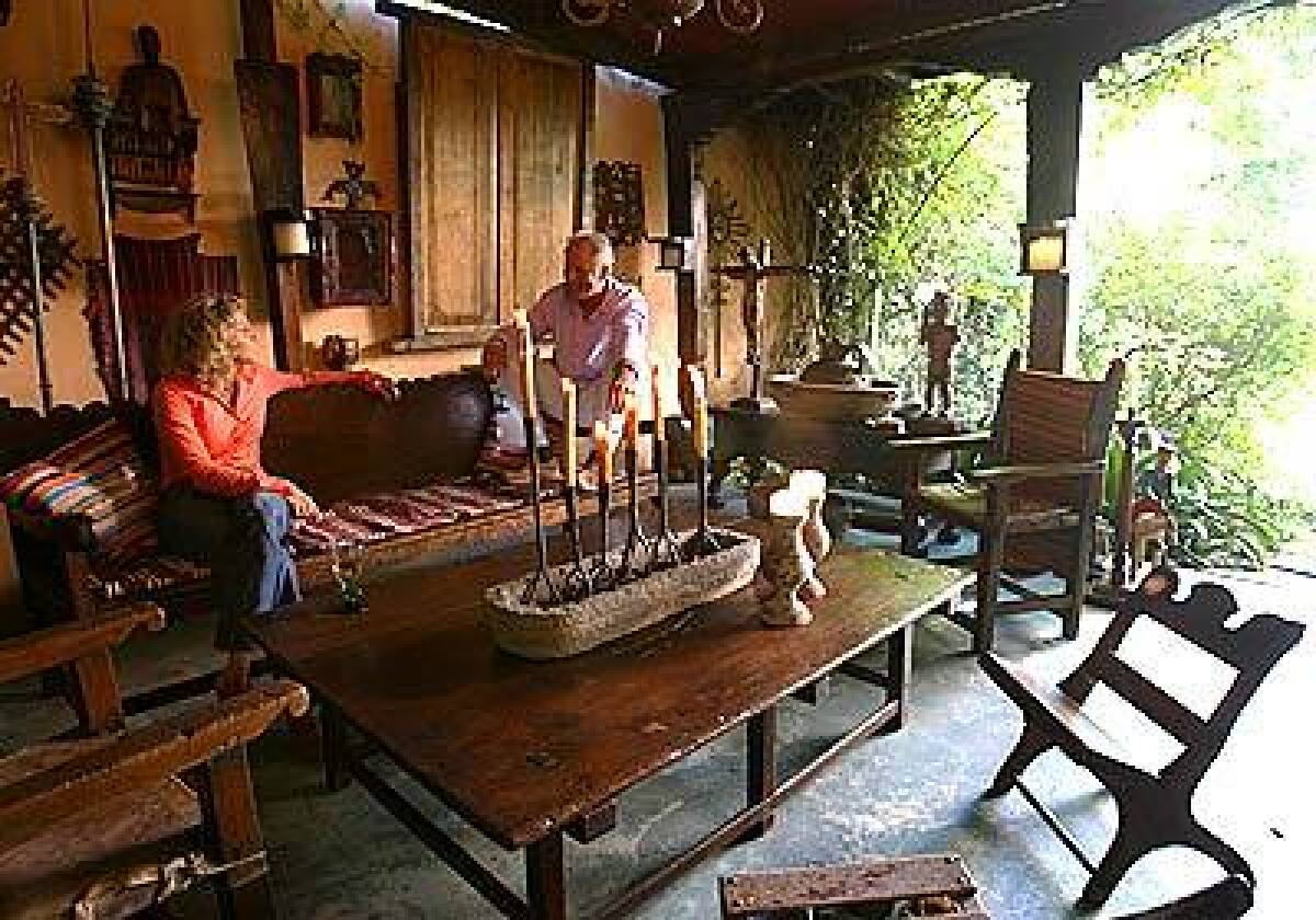 Outdoor rooms can be as decorative and intimate as anything indoors. Gail Dodge Altman and Charles Boswell kick back in a tin-roofed backyard retreat in their Hollywood home. The room is framed by Spanish colonial arches and furnished with farmhouse antiques, architectural elements and religious icons from Guatemala. Its mostly a space for entertaining, they say, though our son likes to escape the house and hang out here.