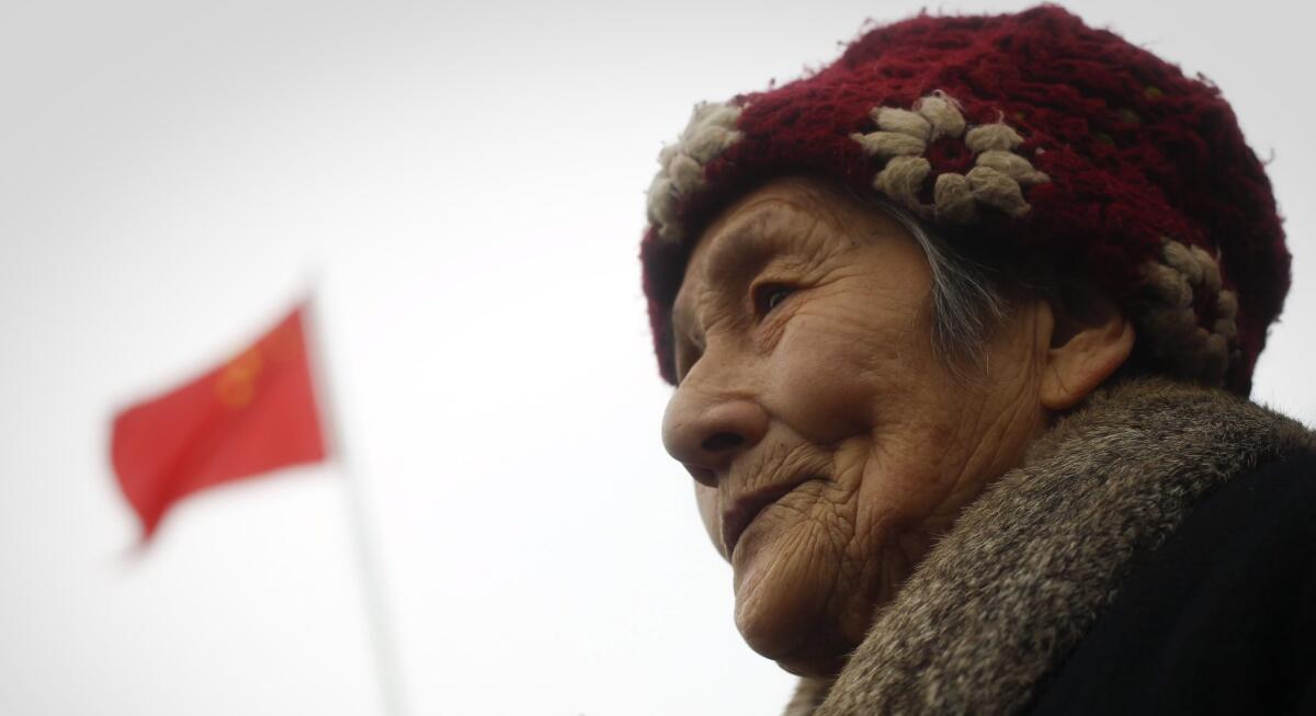 Li Shufeng, 89, attends a ceremony to observe the 75th anniversary of the Nanking Massacre. Shufeng is a survivor of the massacre.