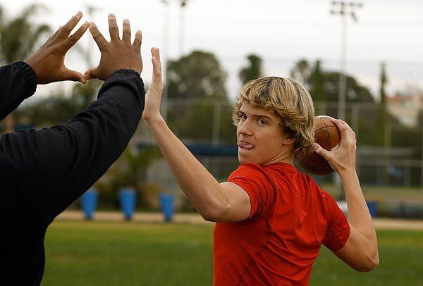 Quarterback coach Steve Clarkson works with 15-year-old David Sills at Venice High School. Clarkson has polished a string of several successful USC quarterbacks including Matt Leinart and Matt Barkley.