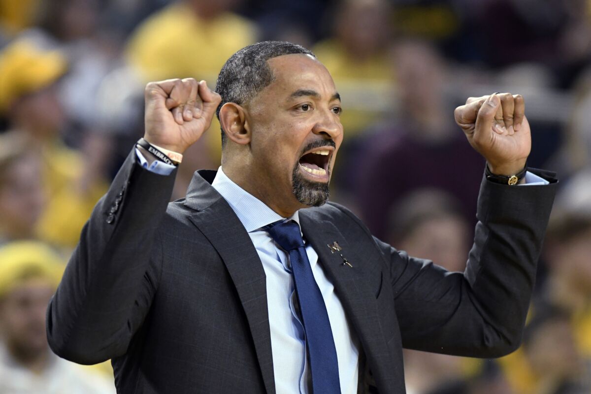Michigan coach Juwan Howard calls in a play to the team as it played against Nebraska during the first half of an NCAA college basketball game Thursday, March 5, 2020, in Ann Arbor, Mich. (AP Photo/Jose Juarez)