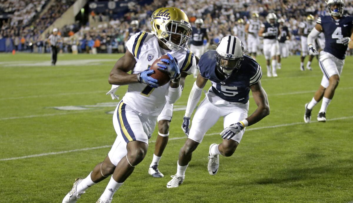 Bruins receiver Darren Andrews heads toward the end zone on a 33-yard touchdown pass play against BYU on Sept. 17.