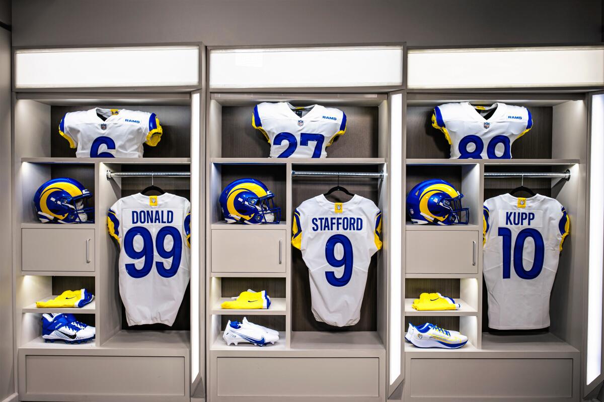 The Rams' new uniforms are displayed in lockers.