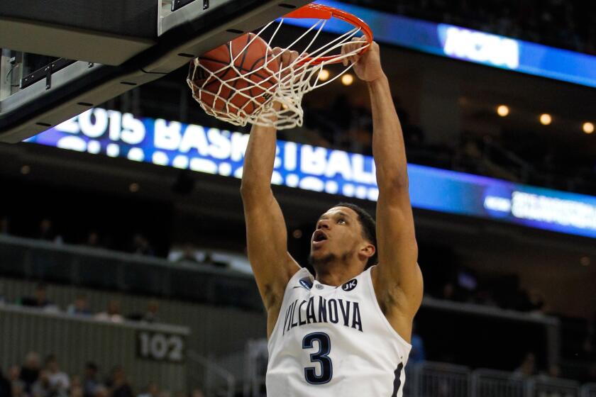 Villanova guard Josh Hart throws down a slam in the second half of the Wildcats' 93-52 victory against Lafayette in the NCAA tournament.