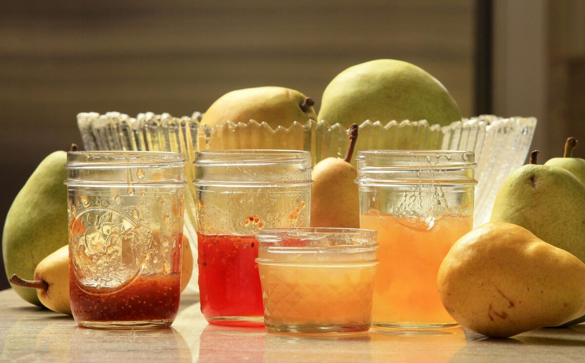 View of four jams in the kitchen of Jane Carroll, LtoR: orange-Cointreau-fig, tomato-cardamom, lemon-ginger, and pear. — Charlie Neuman